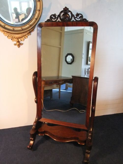 a mahogany cheval mirror