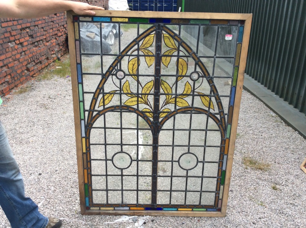 large decorative leaded and painted glass window