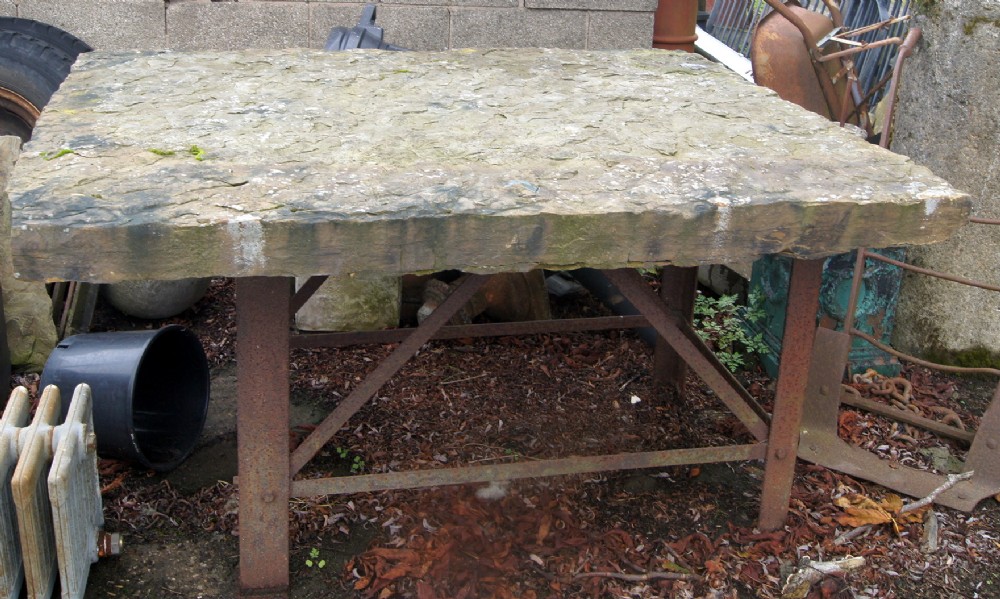 a stone rustic architectural garden table