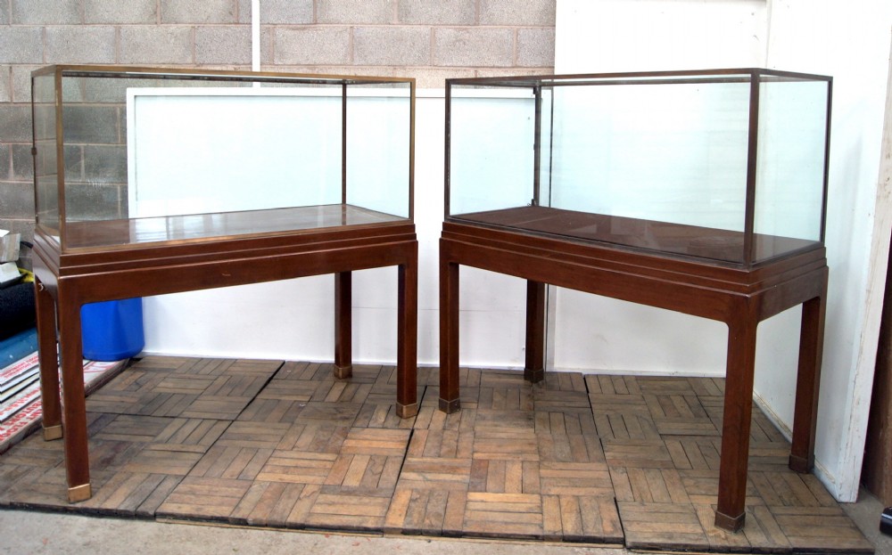 an excellent pair of bronze and mahogany museum cabinets