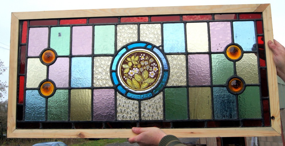 a lovely stained glass painted flower window