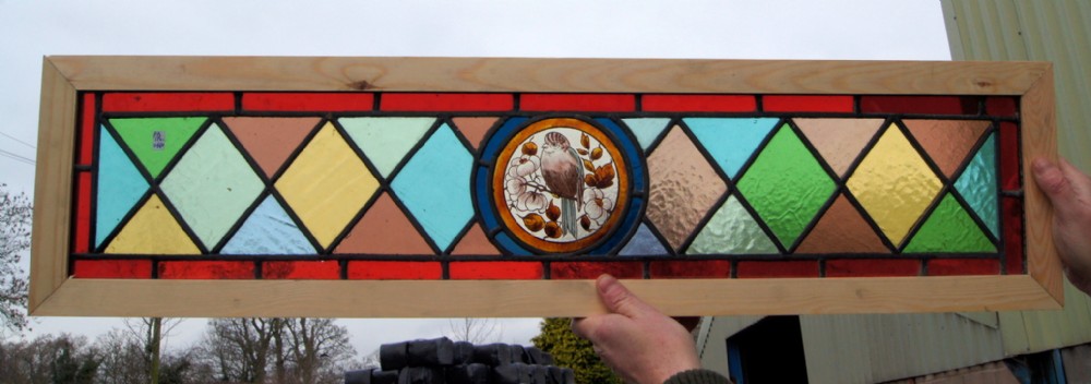 a vibrant stained glass painted bird window