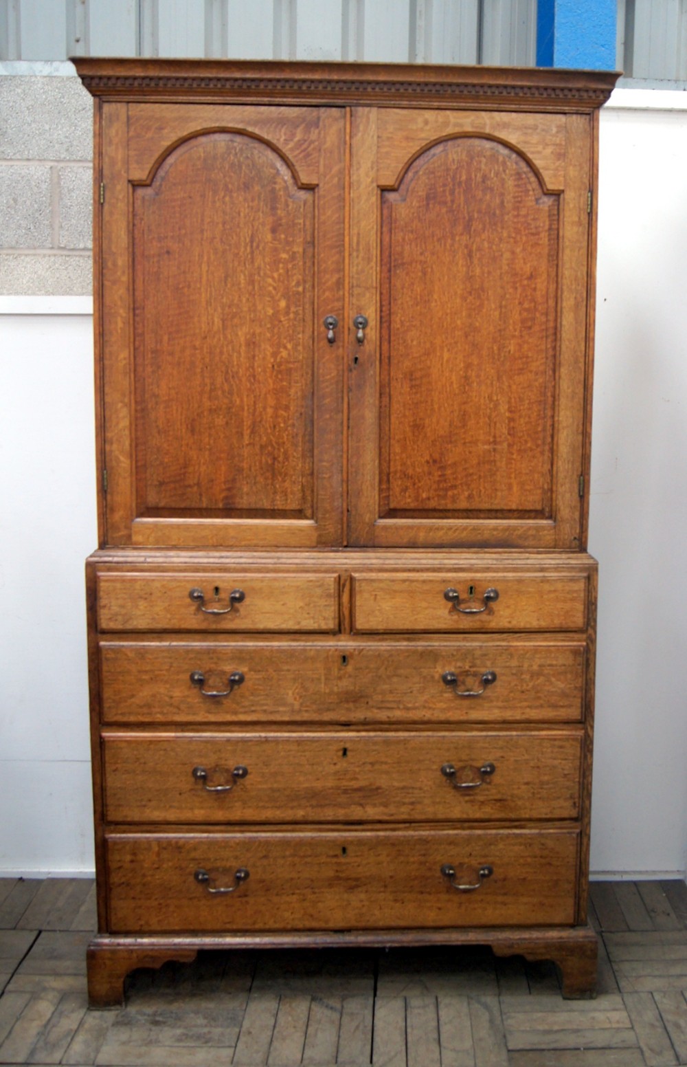 a charming pale oak country cupboard on chest