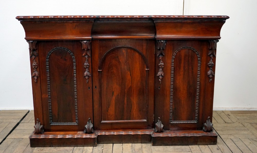 a petite rosewood inverted breakfront chiffonier