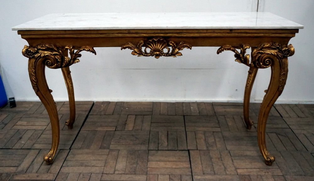 a good quality carved gilded wood and marble centre table
