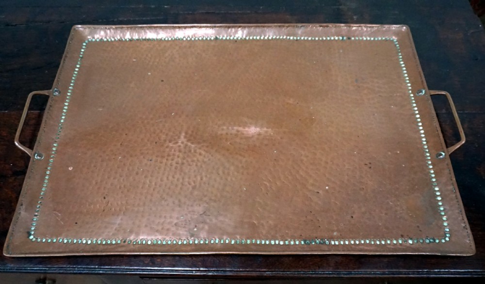 a good arts and crafts copper tray by the famous manufacturer john pearson