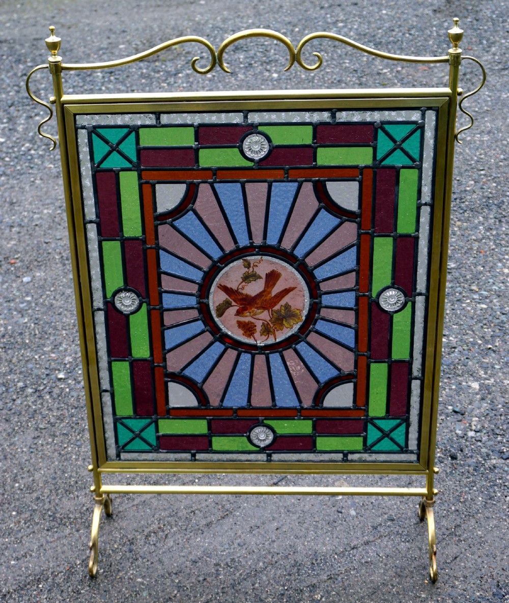 a good late victorian leaded glass and brass fire screen