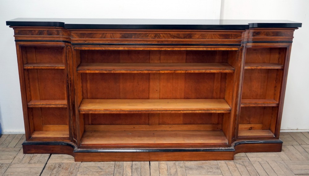 a magnificent narrow victorian walnut and ebonised open shelf bookcase