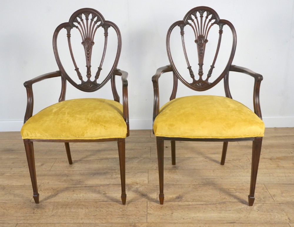 an exceptional pair of antique mahogany armdesk chairs