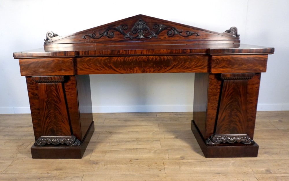 a sumptuous regency mahogany pedastal sideboard