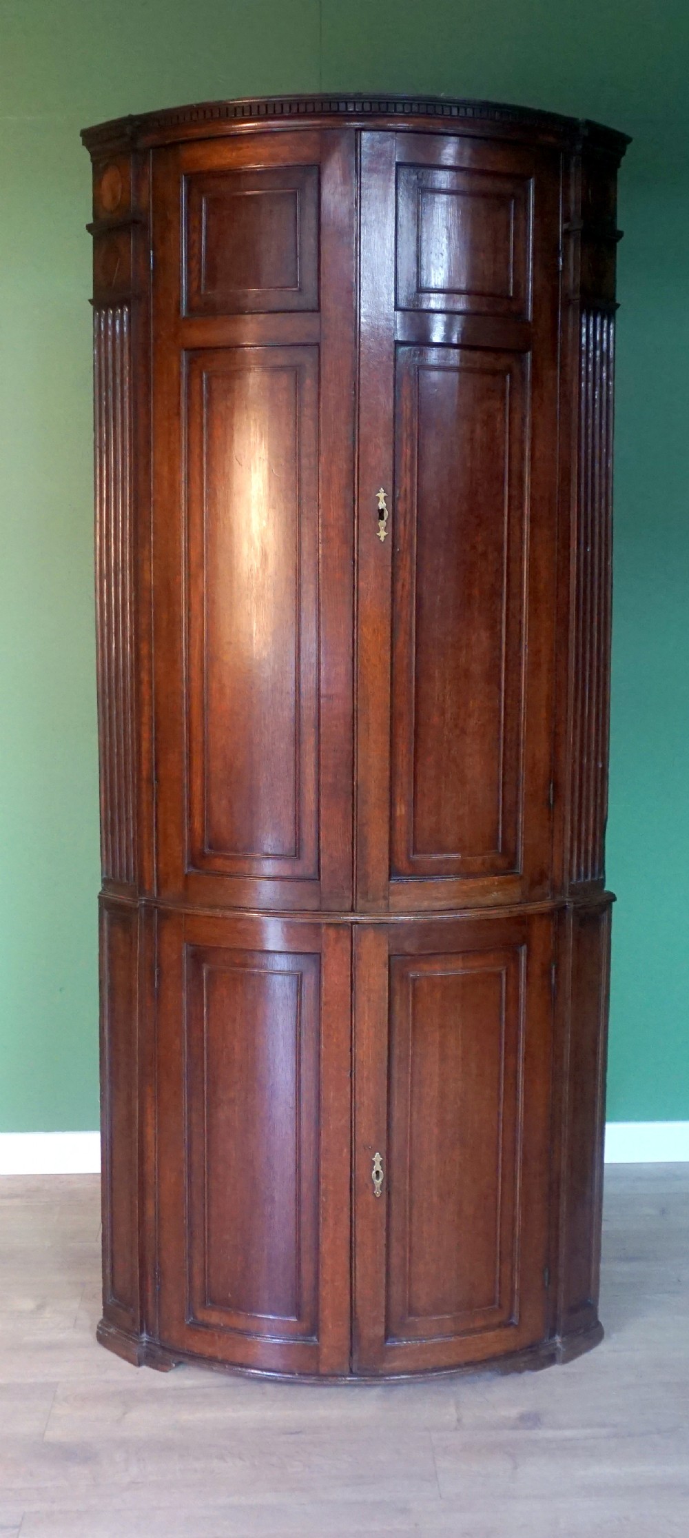 a great original example of a bow fronted oak georgina floor standing corner cupboard