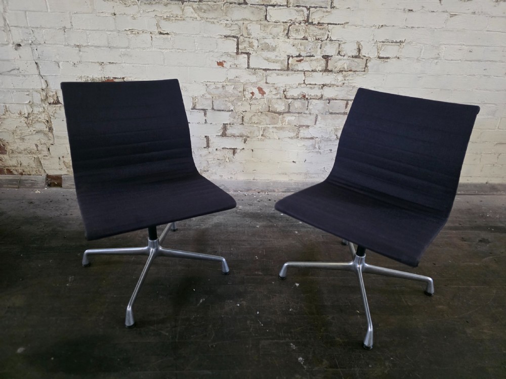 pair of midcentury vitra ea 105 office chairs in navy